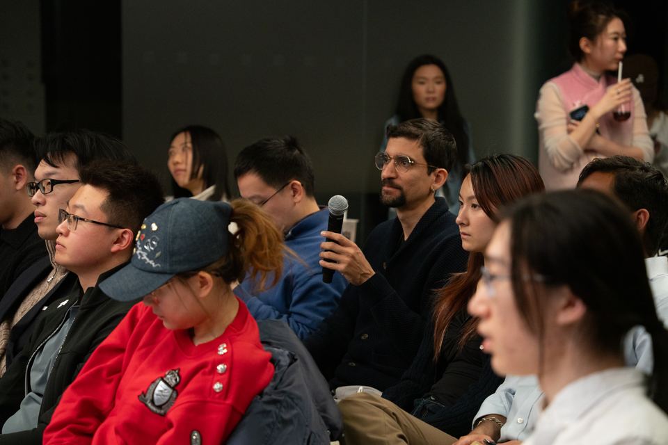 An attendee asking a question from the audience